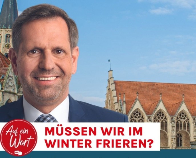 Foto von Olaf Lies auf dem Altstadtmarkt. Text: Auf ein Wort - Müssen wir im Winter alle frieren?